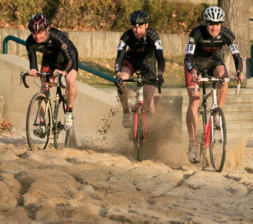 Cyclocross racers Chris Huebner (left), Daniel Enns and John Paul Peters race through a sand spot at The Forks. The 2013 Manitoba Cyclocross Championships at The Forks on Sunday. Cyclocross includes riding on grass, dirt, sand and running over obstacles carrying the bike. 131023 - Wednesday, October 23, 2013 - (Melissa Tait / Winnipeg Free Press)