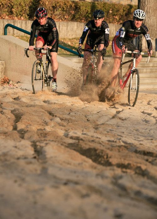 Cyclocross racers Chris Huebner (left), Daniel Enns and John Paul Peters race through a sand spot at The Forks. The 2013 Manitoba Cyclocross Championships at The Forks on Sunday. Cyclocross includes riding on grass, dirt, sand and running over obstacles carrying the bike. 131023 - Wednesday, October 23, 2013 - (Melissa Tait / Winnipeg Free Press)