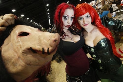 November 1, 2013 - 131101  -  Lylia Chorosive (L) as Amanda Young Jigsaw Killer's apprentice from Saw and Brie Yaworski as Poison Ivy from Batman at opening day of Comic Con at the Convention centre Friday, November 1, 2013. John Woods / Winnipeg Free Press