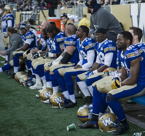 131102 Winnipeg - DAVID LIPNOWSKI / WINNIPEG FREE PRESS (November 02, 2013)  The Winnipeg Blue Bombers look dejected during the final moments of the last game of the inaugural season against the Hamilton Tiger-Cats Saturday afternoon at Investors Group Field.