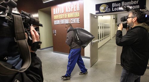 Winnipeg Blue Bomber Terrell Parker leaves the dressing room with his belongings in a plastic bag the day after the team played the last game of the season.  131103 November 3, 2013 Mike Deal / Winnipeg Free Press