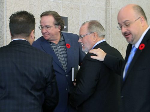 In centre, two new  Executive Policy Committee members Councillor Justin Swandel (left) and Councillor Grant Nordman after the Mayor's announcement Monday morning.  Aldo Santin story  Wayne Glowacki / Winnipeg Free Press Nov. 4. 2013