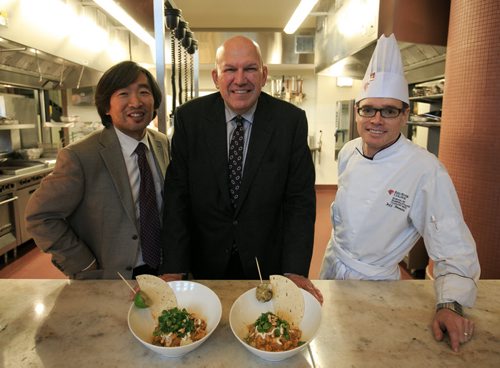 Stan Chung, VP Academic & Research at Red River College (left) with Craig Evans, CEO, Grannys Poultry and Chef Jeffrey Brandt, RRC Instructor with the curry chicken dish made with with Granny's Poultry newly developed chicken that is fed flax, alfalfa and ginseng. 131104 - Monday, November 04, 2013 - (Melissa Tait / Winnipeg Free Press)