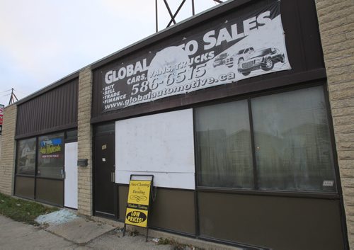The Global Auto Sales at 502 Dufferin Ave. is boarded up Tuesday morning after an overnight fire.Wayne Glowacki / Winnipeg Free Press Nov. 5. 2013