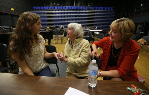 Kay Tworek (middle) and her daughter, Glenlawn Collegiate community liaison worker Margaret Lapenskie, look at part of the script with cast member Suzie Brown, who portrays the young Kay Tworek, during rehearsal on Mon., Nov. 4, 2013, for the Glenlawn Collegiate Remembrance Day production of ÄòPig DogÄô, which is based on the Second World War experiences of the 86-year-old Tworek whose Polish family harboured Royal Canadian Air Force pilot Jack Duggan. Photo by Jason Halstead/Winnipeg Free Press