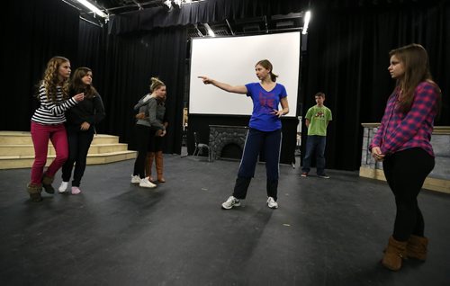 Movement choreography assistant Sarah Roche (third right) works with cast members during rehearsal on Mon., Nov. 4, 2013, for the Glenlawn Collegiate Remembrance Day production of ÄòPig DogÄô, which is based on the Second World War experiences of 86-year-old Kay Tworek whose Polish family harboured Royal Canadian Air Force pilot Jack Duggan. Photo by Jason Halstead/Winnipeg Free Press