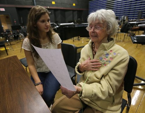 Kay Tworek (right) look at part of the script with cast member Suzie Brown, who portrays the young Kay Tworek, during rehearsal on Mon., Nov. 4, 2013, for the Glenlawn Collegiate Remembrance Day production of ÄòPig DogÄô, which is based on the Second World War experiences of the 86-year-old Tworek whose Polish family harboured Royal Canadian Air Force pilot Jack Duggan. Photo by Jason Halstead/Winnipeg Free Press