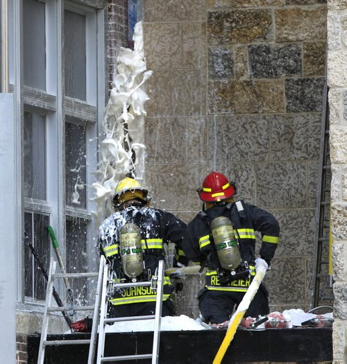 Winnipeg Fire Fighters extinguish a fire with foam that was in the wall by a  new addition under construction at the Glenelm School Tuesday morning. The students and staff were evacuated to a nearby church. No injuries. web story.  Wayne Glowacki / Winnipeg Free Press Nov. 5. 2013