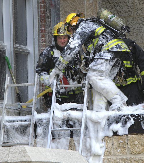 Winnipeg Fire Fighters pack up after extinguishing a fire with foam that was in the wall to the  new addition under construction at the Glenelm School Tuesday morning. The students and staff were evacuated to a nearby church. No injuries. web story.  Wayne Glowacki / Winnipeg Free Press Nov. 5. 2013