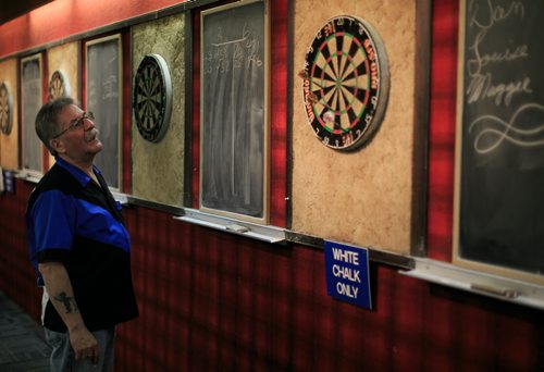 Bud Hawkins scores a shot in a game of darts at the St. James Legion on Portage Ave.  Legions story by Mary Agnes 131016 - Wednesday, October 16, 2013 - (Melissa Tait / Winnipeg Free Press)