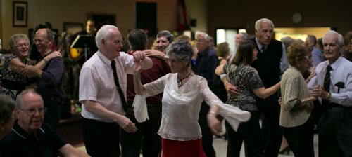Lillian Wright (in red skirt) and partner Ken Palen dance at the Norwood St. Boniface Legion weekly Saturday Night Dance.  Legions story by Mary Agnes 131026 - Saturday, October 26, 2013 - (Melissa Tait / Winnipeg Free Press)