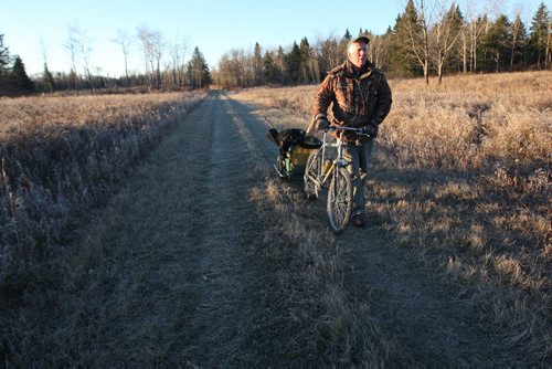 Dr. Vince Crichton- Certified Wildlife Biologist  uses his mountain bike to look for moose in Riding Mountain National Park See Alex Paul Moose feature- October 2013   (JOE BRYKSA / WINNIPEG FREE PRESS)