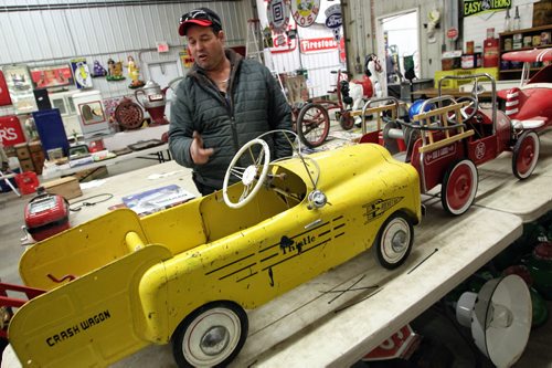 Auctioneer, Stuart McSherry, goes through some of the items he is getting ready for this weekends auction in Stonewall, MB. Highly sought after gas station signs, vintage pumps, and other memorabilia will be up for auction Sunday, November 10.  131106 - November 6, 2013 MIKE DEAL / WINNIPEG FREE PRESS