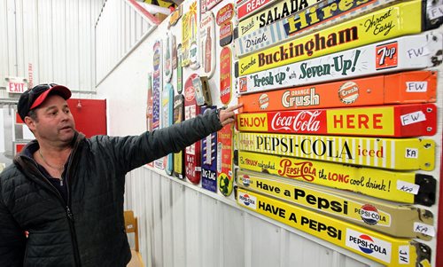 Auctioneer, Stuart McSherry, goes through some of the items he is getting ready for this weekends auction in Stonewall, MB. Highly sought after gas station signs, vintage pumps, and other memorabilia will be up for auction Sunday, November 10.  131106 - November 6, 2013 MIKE DEAL / WINNIPEG FREE PRESS