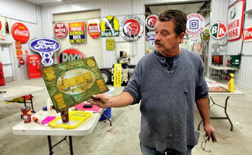 Bill Krasey gets some of the items ready for this weekends auction in Stonewall, MB. McSherry Auction Service will be putting up for sale some highly sought after gas station signs, vintage pumps, and other memorabilia Sunday, November 10.  131106 - November 6, 2013 MIKE DEAL / WINNIPEG FREE PRESS