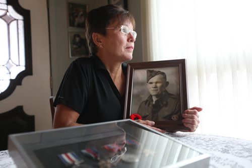 Mae Gulewich, whose father was one of the 29 men on   block on Dufferin Avenue in Selkirk who had enlisted at one time in the Second World War, thought to be a record.  Mae Gulewich, with a picture of her father and his medals in her home in Selkirk.  See Bill Redekop's story.  November 06,,  2013 Ruth Bonneville / Winnipeg Free Press