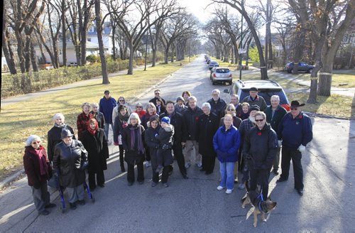 In foregound at right is Thomas McLeod, chair of the Armstrong's Point Association with a group of residents that are taking the city to court because they are upset about the private school expansion in their neighbourhood. Kevin Rollason   story Wayne Glowacki / Winnipeg Free Press Nov. 7. 2013