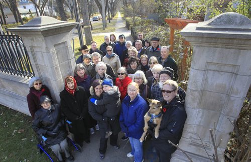 At right, Thomas McLeod, chair of the Armstrong's Point Association with a group of residents that are taking the city to court because they are upset about the private school expansion in their neighbourhood. Kevin Rollason   story Wayne Glowacki / Winnipeg Free Press Nov. 7. 2013