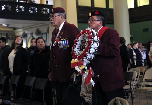 At left,  Joe Meconse, pres. and Jerry Woodhouse,  Sergeant-at-Arms with the Manitoba Chapter of the National Aboriginal Veterans Association of Canada  lay a wreath on behalf of the organiztion during the Aboriginal Veterans Day ceremony. About 250 attended the ceremony at the Aboriginal Centre of Winnipeg Friday to acknowledge and honour the contributions Aboriginal Veterans have made to Canada and the world.      Wayne Glowacki / Winnipeg Free Press Nov. 8. 2013