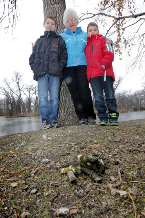 Jacob and Andrew DeBlaere stand with their grandmother Kathy Lesyk in St. Vital Park. There is alot of goose poop there and they want something done about it. BORIS MINKEVICH / WINNIPEG FREE PRESS  November 8, 2013