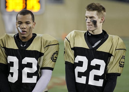 Garden City Gophers, Nathan Collings and Keenan Koswin, dejected after losing. The St.Paul's Crusaders AA football team won the Free Press Bowl Championship game over the Garden City Fighting Gophers by a score of 32-0 at Investors Group Field, Friday, November 8, 2013. (TREVOR HAGAN/WINNIPEG FREE PRESS)