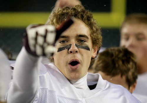 Adam Leckie of the St.Paul's Crusaders AA football team celebrates their Free Press Bowl Championship victory over the Garden City Fighting Gophers by a score of 32-0 at Investors Group Field, Friday, November 8, 2013. (TREVOR HAGAN/WINNIPEG FREE PRESS)