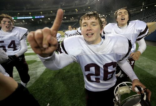 Heath Chalmers of the St.Paul's Crusaders AA football team celebrates after they defeated the Garden City Gophers in the Free Press Bowl Championship game at Investors Group Field, Friday, November 8, 2013. (TREVOR HAGAN/WINNIPEG FREE PRESS)