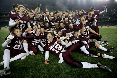 The St.Paul's Crusaders AAA football team celebrates their Anavet Cup victory over the Murdoch McKay Clansmen by a score of 56-8 at Investors Group Field, Friday, November 8, 2013. (TREVOR HAGAN/WINNIPEG FREE PRESS)