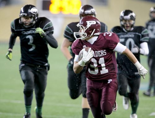 Austin Coutts of the The St.Paul's Crusaders AAA football runs for an easy score during his teams; Anavet Cup victory over the Murdoch McKay Clansmen by a score of 56-8 at Investors Group Field, Friday, November 8, 2013. (TREVOR HAGAN/WINNIPEG FREE PRESS)