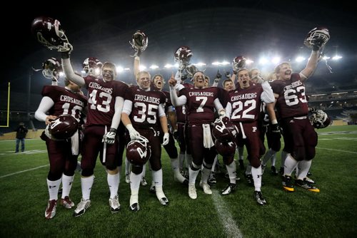 The St.Paul's Crusaders AAA football team celebrates their Anavet Cup victory over the Murdoch McKay Clansmen by a score of 56-8 at Investors Group Field, Friday, November 8, 2013. (TREVOR HAGAN/WINNIPEG FREE PRESS)