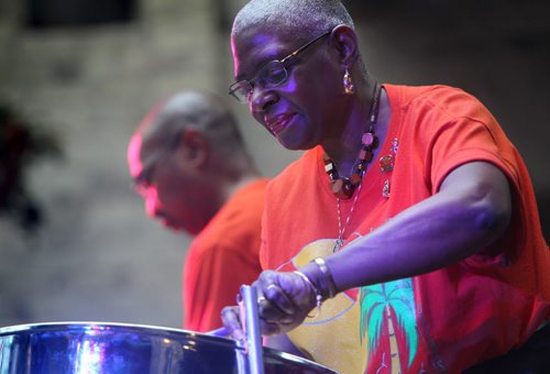 Winnipeg Steel Orchestra player Agnes Gonzales (front)  plays the steel pan with flellow member Ruthven Nimblett on stage at the Forks Market during the Many Worlds Festival celebrating the America's  Saturday afternoon.  The MWF s a partnership between Folklorama and the Forks Market and runs each weekend at the Forks hosting different cultures around the world. Standup photo. November 09,,  2013 Ruth Bonneville / Winnipeg Free Press