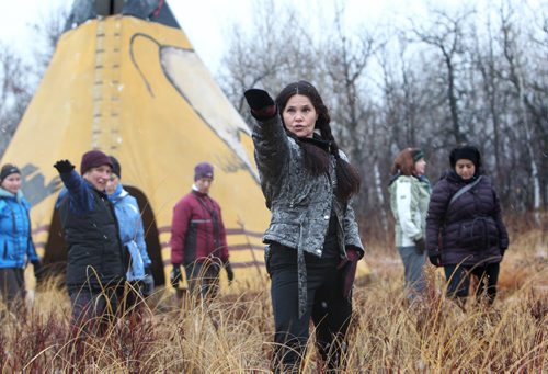 Yoga instructor Catherine Moore heads up her yoga class called Inside Out Yoga amidst the tall grass at  Fort Whyte Saturday morning.  The class runs for 6 weeks and is open to all levels. Standup photo. November 09,,  2013 Ruth Bonneville / Winnipeg Free Press