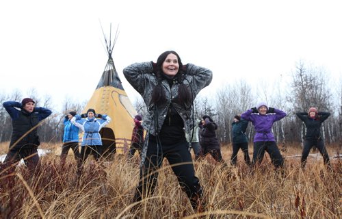 Yoga instructor Catherine Moore heads up her yoga class called Inside Out Yoga amidst the tall grass at  Fort Whyte Saturday morning.  The class runs for 6 weeks and is open to all levels. Standup photo. November 09,,  2013 Ruth Bonneville / Winnipeg Free Press