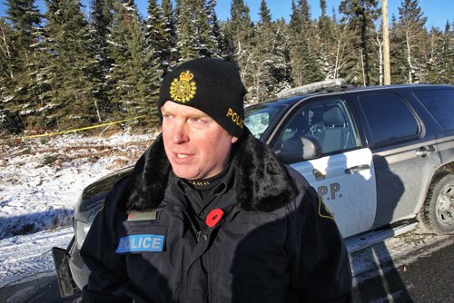 Const. David Lamme, Ontario Provincial Police at the scene of the plane crash near Red Lake, Ontario. A Bearskin Airline plane crashed just before landing killing five while two others survived.  131111 November 11, 2013 Mike Deal / Winnipeg Free Press