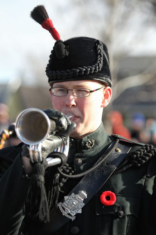 Cpl. Evan Joyal  with the Regimental Band of the Royal Winnipeg Rifles plays the bugle during the Remembrance Day ceremonies at the Valour Road memorial.   131111 November 11, 2013 Mike Deal / Winnipeg Free Press
