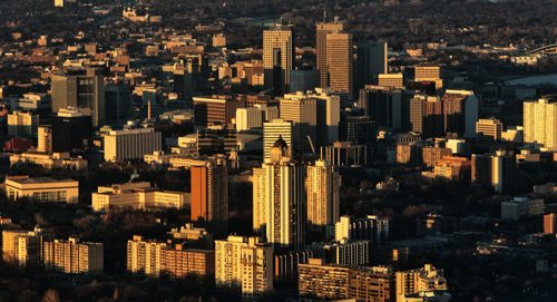 A golden light is cast on Winnipeg buildings from the setting sun Monday.  131111  November 11, 2013  Mike Deal / Winnipeg Free Press skyline