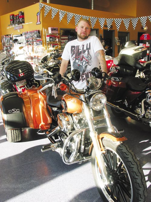 Canstar Community News Nov. 6, 2013 - Josh Kapitan stands beside one of the motorcycle conversions completed for a customer at Griffin Trikes in the RM of Macdonald. (ANDREA GEARY/CANSTAR COMMUNITY NEWS)
