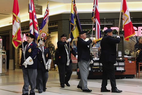 Canstar Community News Members of the Royal Canadian Legion, Transcona Branch No. 7 Colour Party, march on the colours during the opening ceremony of Kildonan Place Mall's unveiling of its Remembrance Day display. (JORDAN THOMPSON)
