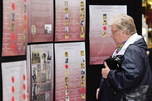 Canstar Community News A woman looks at one of the Remembrance Day displays currently set up at Kildonan Place Mall by the Transcona Historical Museum. (JORDAN THOMPSON)