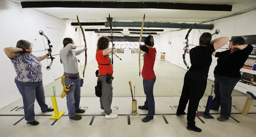 November 1, 2013 - 131101  -  (L to R) Deb Clarke, Inga Thorsteinson, Wendy Roberts, Heather Zueff, Colby Sabourin and Karen Brownlee take aim at The Heights Archery centre Friday, November 1, 2013. Bows, Broads and Bullseyes - a brand new, all-women archery group - gathers at the Heights on Friday nights to take dead aim at balloons, targets, you name it. Skill level ranges from beginner to competitive. John Woods / Winnipeg Free Press