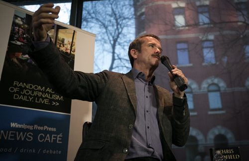 Col. Chris Hadfield explains the intricacies of space flight to a packed Winnipeg Free Press News Café on Wednesday. The Canadian Astronaut gained fame aboard the International Space Station at the beginning of 2013.  131113 - Wednesday, November 13, 2013 - (Melissa Tait / Winnipeg Free Press)