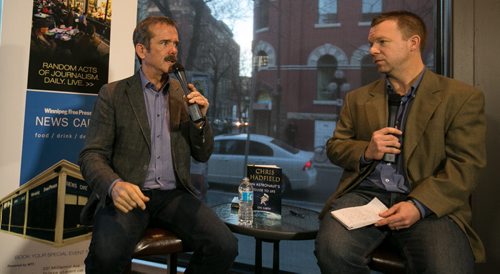 Col. Chris Hadfield talks with reporter Geoff Kirybson on the intricacies of space flight to a packed Winnipeg Free Press News Café on Wednesday. The Canadian Astronaut gained fame aboard the International Space Station at the beginning of 2013. 131113 - Wednesday, November 13, 2013 - (Melissa Tait / Winnipeg Free Press)