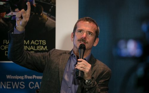 Col. Chris Hadfield explains the intricacies of space flight to a packed Winnipeg Free Press News Café on Wednesday. The Canadian Astronaut gained fame aboard the International Space Station at the beginning of 2013. 131113 - Wednesday, November 13, 2013 - (Melissa Tait / Winnipeg Free Press)