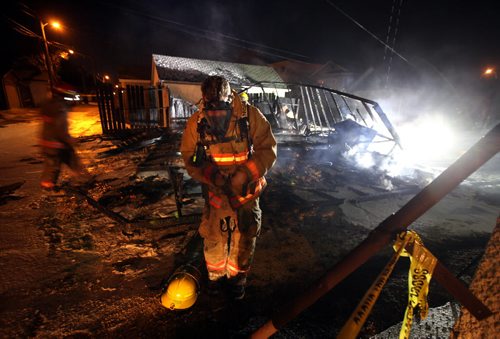 City firefighters douse a garage fire in the 900 block of Mountain ave Wednesday evening. See Ashley Prest tale. November 13, 2013 - (Phil Hossack / Winnipeg Free Press)
