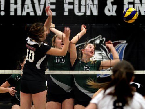 Left to right, Westwood Warrior #10 Katie Hamm, Vincent Massy Trojan #10 Beth Tooth and #2 Mikayla Sellers-Wiebe react to Hamms tip over the net Wednesday afternoon at the WWAC Volleyball Playoffs. November 13, 2013 - (Phil Hossack / Winnipeg Free Press)