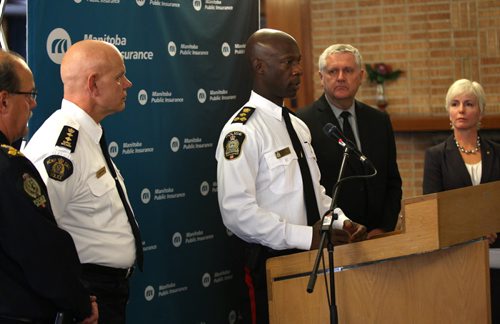 L to R- Brandon Police Chief Ian Grant, RCMP Chief Superintendent Scott Kolody,Winnipeg Police Service Chief Devon Clunis, Minister Gord McIntosh and  Mary Anne Remple  VP Manitoba Public Insurance stood side by side today announcing MPIs funding of 9 Manitoba police agencies to fight and charge those who insist in texting and driving on Manitoba roads    Standup photo- Oct 30, 2013   (JOE BRYKSA / WINNIPEG FREE PRESS)