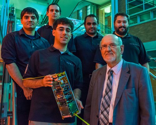 From left to right:  Ahmad Byagowi, Pawel Glowacki, Dario Schor, Reza Fazel-Darbandi, Prof. Witold Kinsner, and Greg Linton with the scientific research satellite at the University of Manitoba. October 15, 2013 Greg Gallinger / Winnipeg Free Press