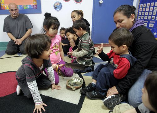 At right, Jordan,3, with his mother Roanna Harper receive smudge at ceremony in the Little Red Spirit Aboriginal Head Start Program at 185 Young St. Mary Agnes Welch story   Wayne Glowacki / Winnipeg Free Press Nov. 14. 2013