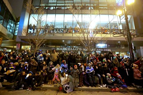 Large crowd on the street and in buildings to watch the Santa Claus Parade on Portage Avenue, Saturday, November 16, 2013. (TREVOR HAGAN/WINNIPEG FREE PRESS)