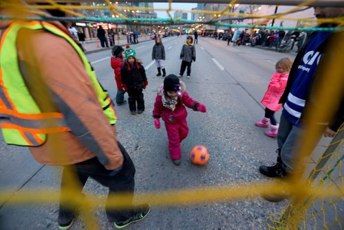 Soccer on the street prior to the Santa Claus Parade on Portage Avenue, Saturday, November 16, 2013. (TREVOR HAGAN/WINNIPEG FREE PRESS)